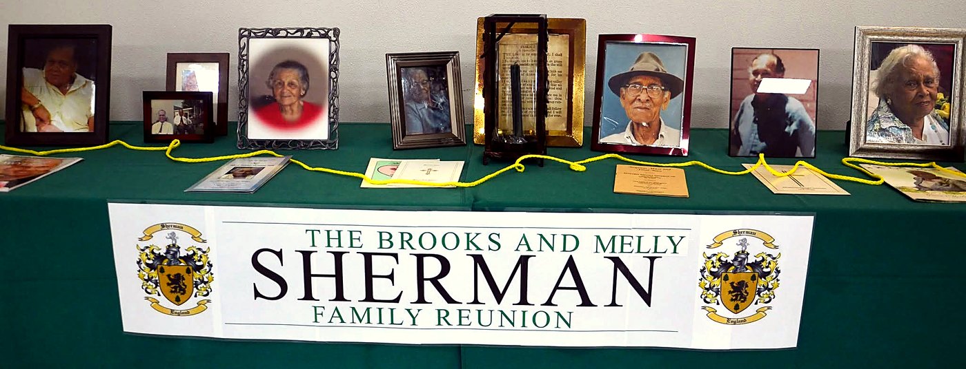 The memorial table at the Brooks and Melly Sherman Family Reunion, with framed photos of family members who have passed